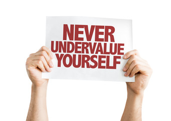 Never Undervalue Yourself placard isolated on white