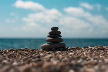 Stack of round smooth stones on a seashore