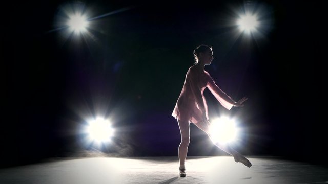 Young ballerina girl dancer jumping high in sky