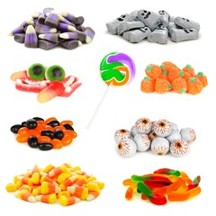 Assortment of Halloween candies in isolated clusters over a white background