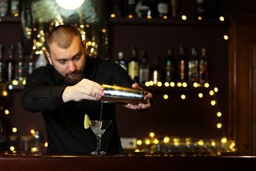 Bartender making cocktail