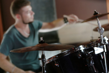 Fototapeta na wymiar Drummer on dark background