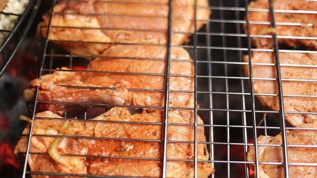 Meat on the grill with flames closeup