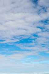 Obraz premium Blue sky and clouds. view from the window of an airplane flying in the clouds