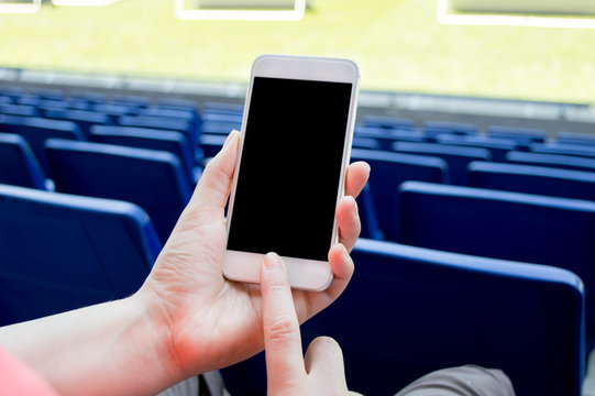 using smartphone in the football stadium