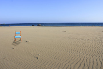Fototapeta na wymiar Chair on Beach