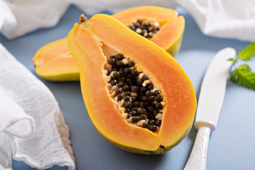 Cut papaya on a blue table