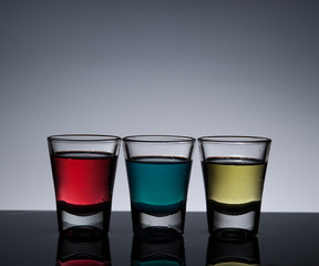 Exotic bottle alcohol cocktail and glass ,dark background