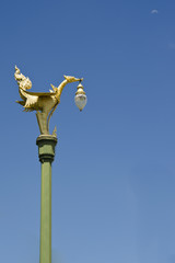Fototapeta na wymiar Gold swan light pole in the public road, Thailand