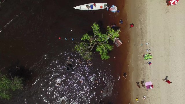 People enjoying a beach in Amazon, Manaus, Brazil