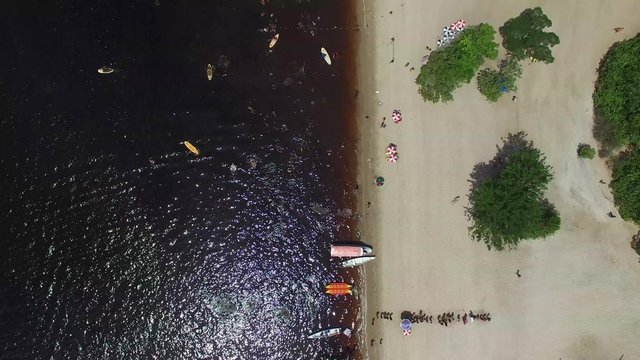People enjoying a beach in Amazon, Manaus, Brazil
