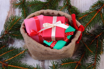 Wrapped gifts in jute bag for Christmas or other celebration
