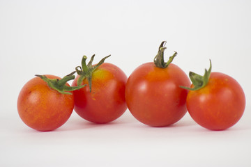 Red tomatoes on white