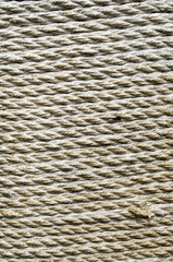 Ecru thick rope wrapped around  pillar