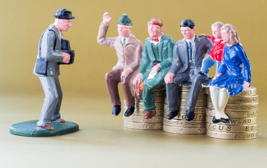 Model Family Sits on British Pound Coins