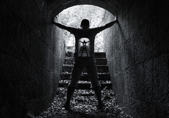 Infinity inner world concept, young man in tunnel