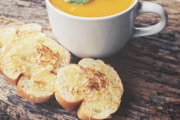 Pumpkin soup with garlic and herb bread