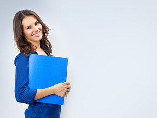 Young smiling businesswoman with blue folder