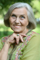 Senior woman in summer park