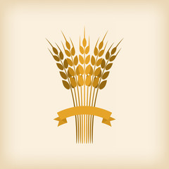 Golden sheaf of wheat with ribbon