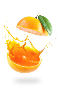 Orange juice splashing isolated on white