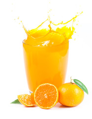 splashing orange juice with oranges against white background
