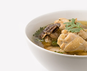Traditional chicken broth on white background
