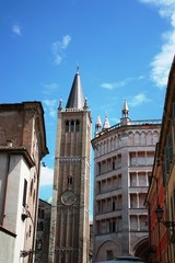 Fototapeta na wymiar The bell tower of the cathedral Santa Maria Assunta and the baptistery in Parma Italy