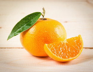Fresh oranges on wooden table