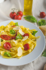 Tagliatelle in Italian colors, roasted tomatoes, basil Tagliatelle