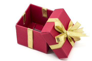 christmas gift box with a gold ribbon bow