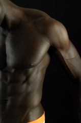A black man with a muscular body,