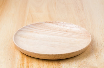 wooden plate on wooden table