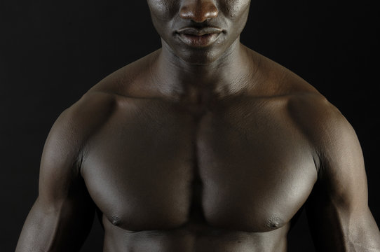 A black man with a muscular body