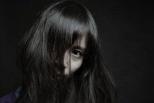 Dark portrait of a pale japanese woman