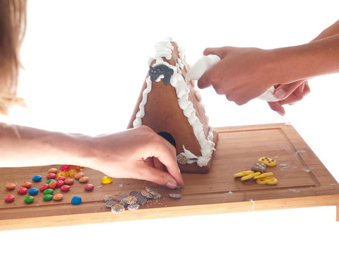 decorating a gingerbread house