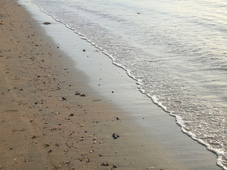Wave of the sea on the sand beach