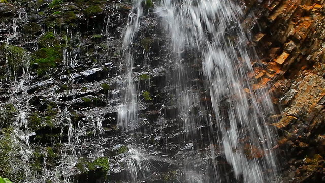 view of the waterfall and rocks closeup