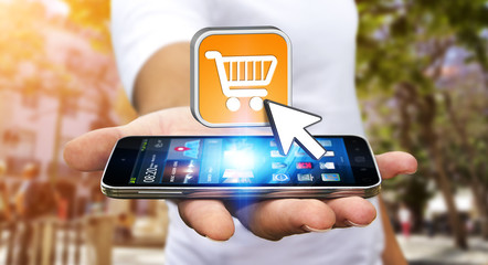 Young man shopping with his mobile phone