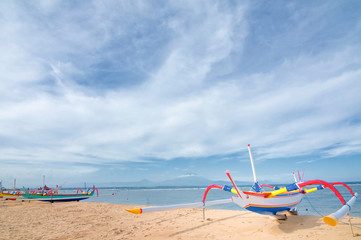 Fototapeta na wymiar Traditional fishing boats in Sanur beach, Bali island, Indonesia