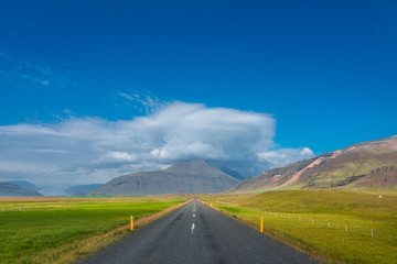 Isolated road and mountain landscape at Iceland, summer time