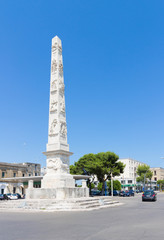 Fototapeta na wymiar The white obelisk in Lecce 