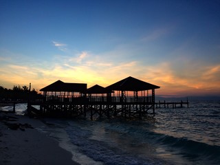 silhouette jetty and sunrise