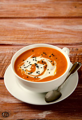 Pumpkin Soup with tomatoes, chili, yogurt and black sesame seeds