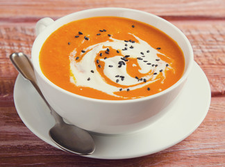 Pumpkin Soup with tomatoes, chili, yogurt and black sesame seeds