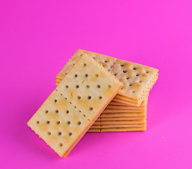 Biscuits on pink background