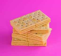 Biscuits on pink background