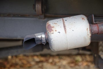 Exhaust pipe of a old car.