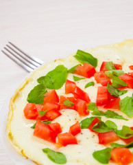 Omelet with tomato and cheese