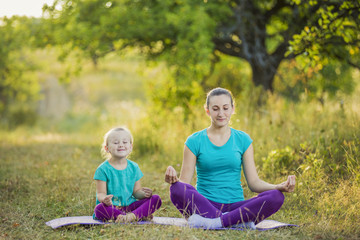 Mom and child in the lotus position